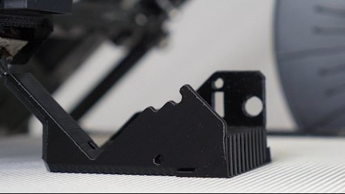 Close-up of a technical component in print; printed with black iFactory3D PETG