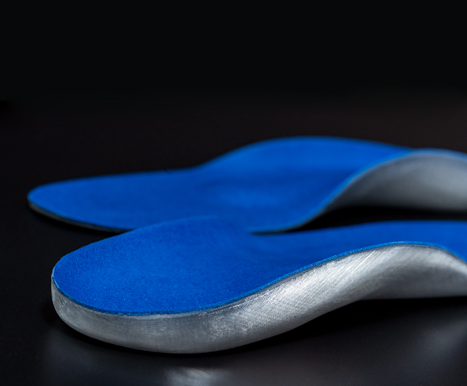 Close-up of 3D printed insoles, afterwards lined with blue felt