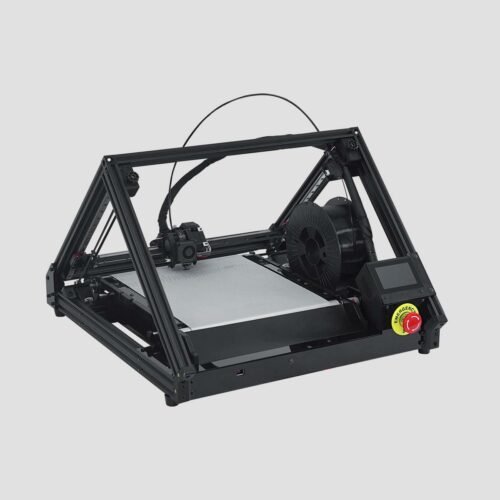 3D conveyor belt printer ONE PRO with pyramid-like structure, black frame and silver print bed; black filament spool in the build area, which is located just behind the display and emergency stop button